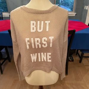 Size sm, the oversize design, a med/lg could wear it too. BUT FIRST WINE